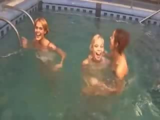 Enticing lezzies in the swimming pool